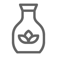 A gray icon of a vase with a plant in it.